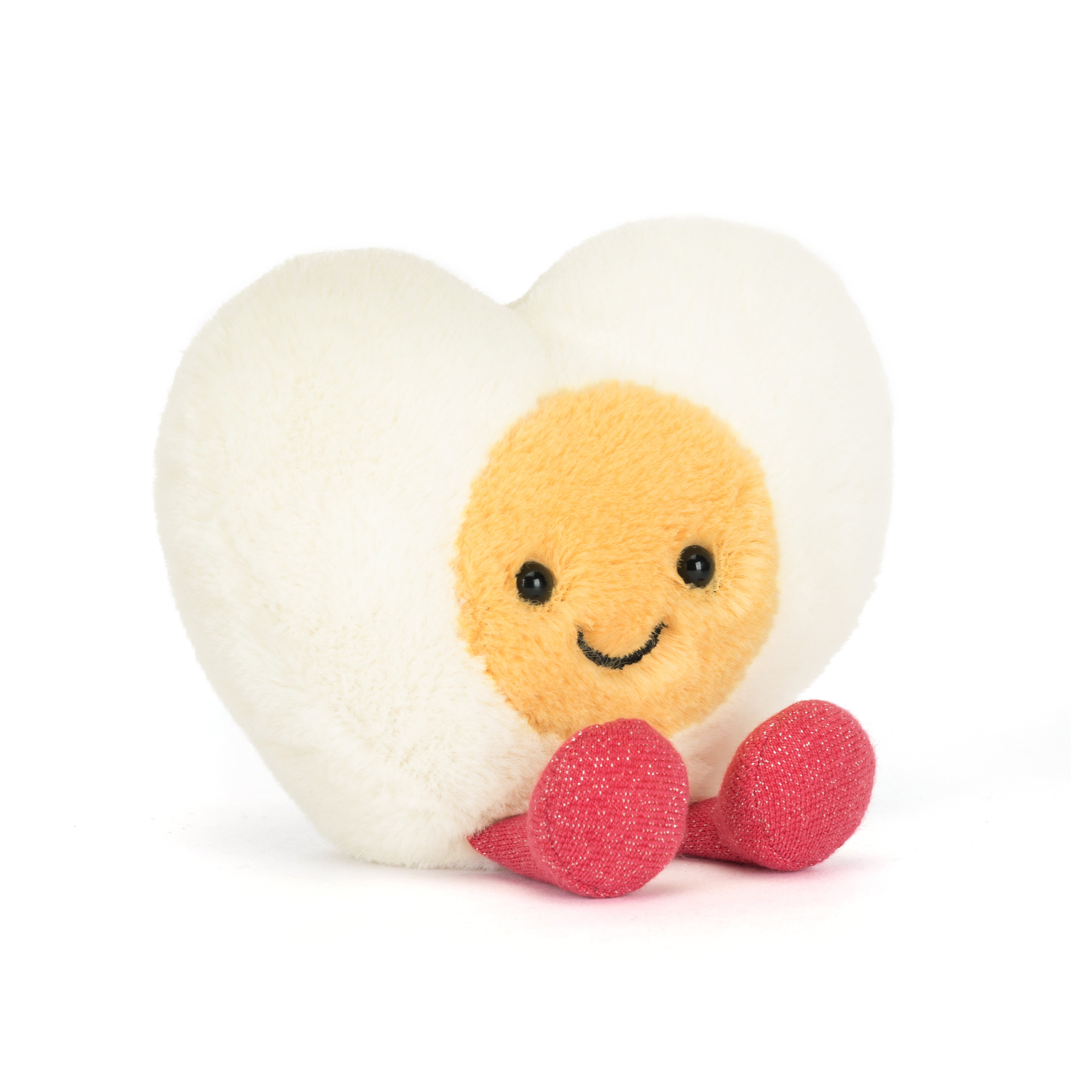 Peluche Jellycat œuf cœur amusant sur lit – Jellycat heart egg plush on bed – Olie & co