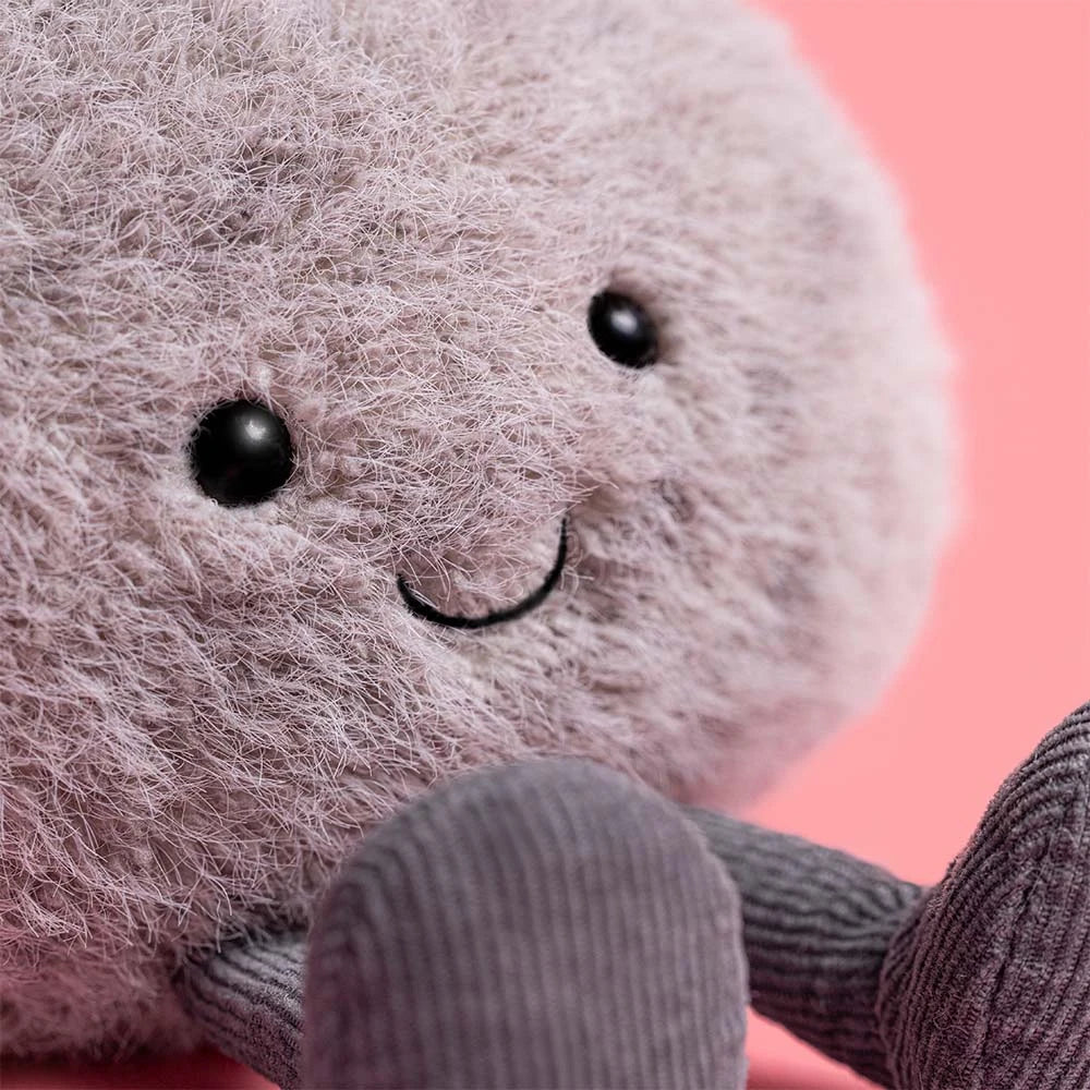 Peluche Jellycat Caillou amusant avec forme ronde grise, sourire brodé et petites jambes en corde – Jellycat Funny Pebble plush with round grey shape, stitched smile and cord legs – Olie & co