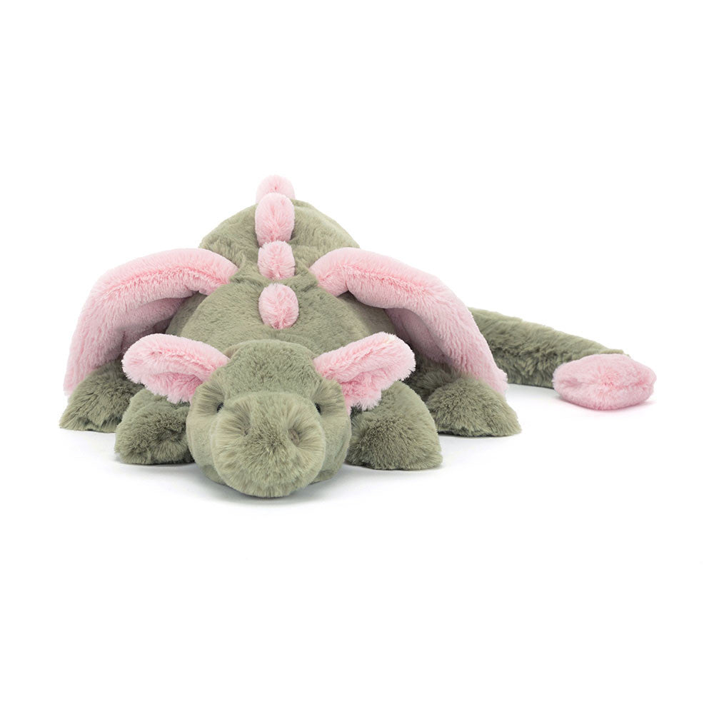 Peluche Jellycat dragon Malachy vert et rose sur lit – Jellycat Malachy dragon green and pink plush on bed – Olie & co