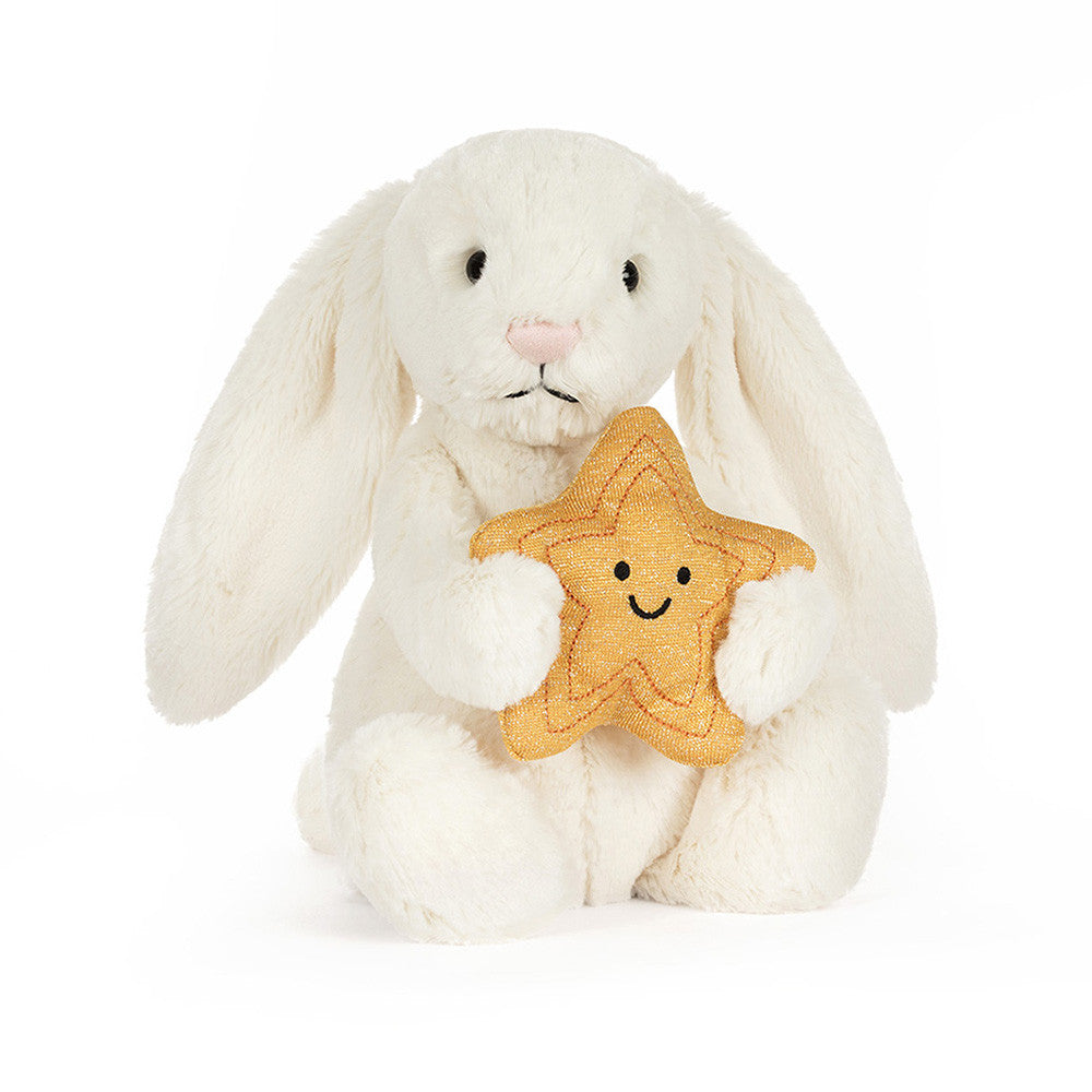 peluche lapin crème Jellycat tenant une étoile dorée dans ses mains - Jellycat cream bunny plush holding a golden star sitting